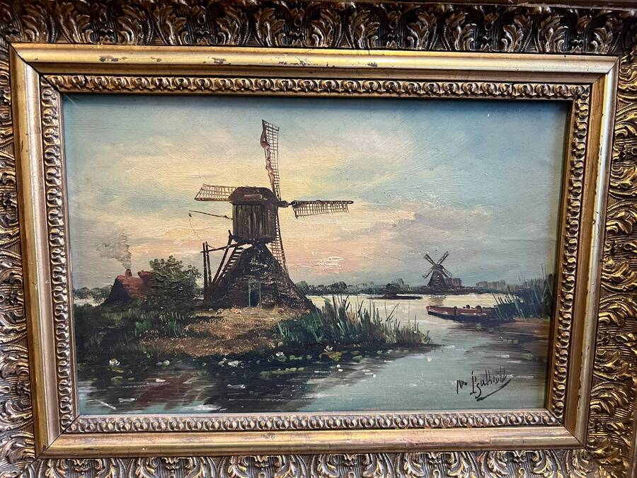 Nederlands polderlandschap met molens en bootje