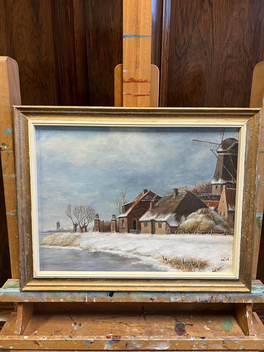 Winterlandschap met boerderij en molen