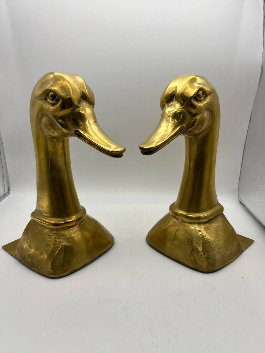Paar zware vergulde messing boekensteunen met eendenkoppen – Art Deco / Mid-Century.